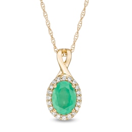 Oval Emerald and 0.08 CT. T.W. Diamond Frame Twist Drop Pendant in 10K Gold