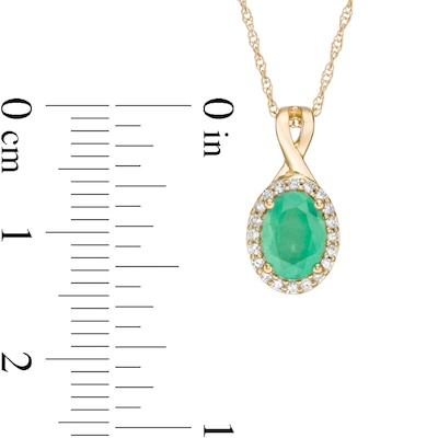 Oval Emerald and 0.08 CT. T.W. Diamond Frame Twist Drop Pendant in 10K Gold