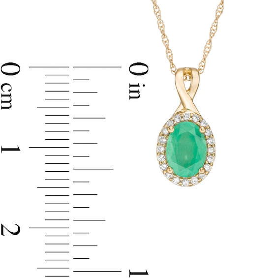 Oval Emerald and 0.08 CT. T.W. Diamond Frame Twist Drop Pendant in 10K Gold