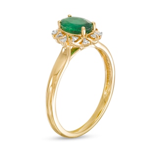 Oval Emerald and 0.04 CT. T.W. Diamond Scallop Frame Floral Ring in 10K Gold