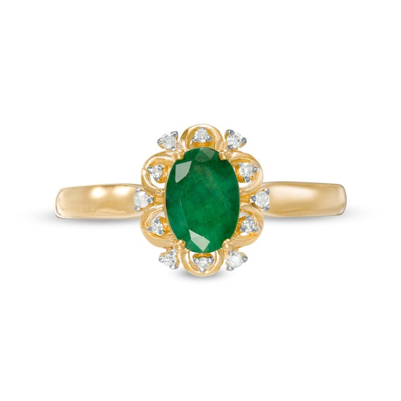 Oval Emerald and 0.04 CT. T.W. Diamond Scallop Frame Floral Ring in 10K Gold