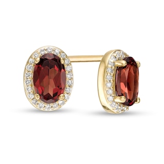 Oval Garnet and 0.088 CT. T.W. Diamond Frame Stud Earrings in 10K Gold