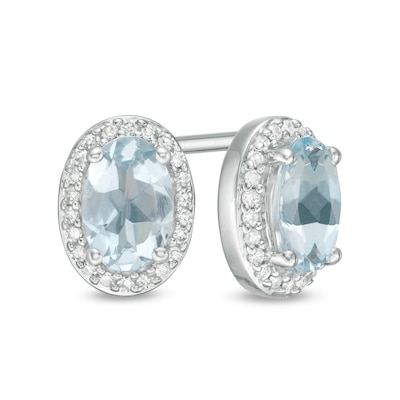 Oval Aquamarine and 0.088 CT. T.W. Diamond Frame Stud Earrings in 10K White Gold