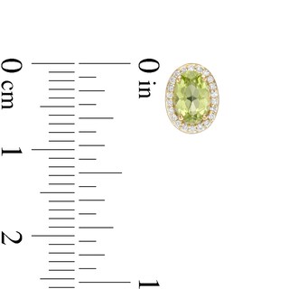 Oval Peridot and 0.088 CT. T.W. Diamond Frame Stud Earrings in 10K Gold