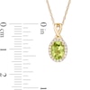 Thumbnail Image 3 of Oval Peridot and 0.08 CT. T.W. Diamond Frame Twisted Split Bail Pendant in 10K Gold