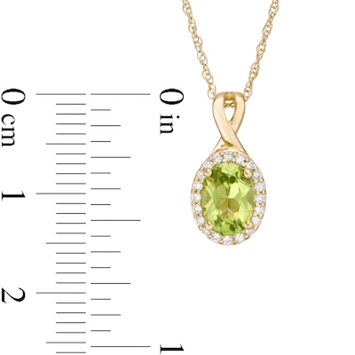 Oval Peridot and 0.08 CT. T.W. Diamond Frame Twisted Split Bail Pendant in 10K Gold