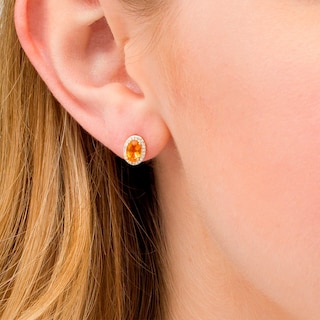 Oval Citrine and 0.088 CT. T.W. Diamond Frame Stud Earrings in 10K Gold