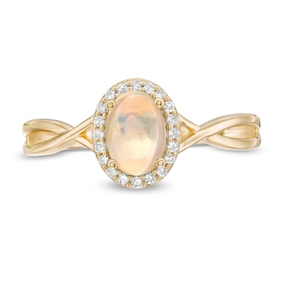 Oval Opal and 0.08 CT. T.W. Diamond Frame Twist Shank Ring in 10K Gold