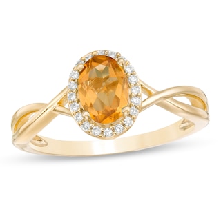 Oval Citrine and 0.08 CT. T.W. Diamond Frame Twist Shank Ring in 10K Gold