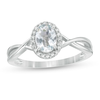 Oval Aquamarine and 0.08 CT. T.W. Diamond Frame Twist Shank Ring in 10K White Gold