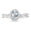 Oval Aquamarine and 0.08 CT. T.W. Diamond Frame Twist Shank Ring in 10K White Gold