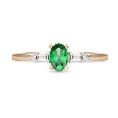 Oval Emerald and 0.10 CT. T.W. Baguette and Round Diamond Side Accent Ring in 10K Gold