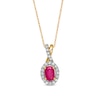 Oval Ruby and 0.15 CT. T.W. Diamond Frame Twist Drop Pendant in 10K Gold