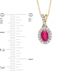 Oval Ruby and 0.15 CT. T.W. Diamond Frame Twist Drop Pendant in 10K Gold