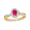 Oval Ruby and 0.20 CT. T.W. Diamond Frame Twisted Bypass Split Shank Ring in 10K Gold