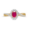 Oval Ruby and 0.20 CT. T.W. Diamond Frame Twisted Bypass Split Shank Ring in 10K Gold