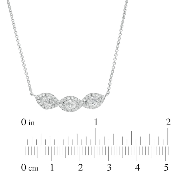 0.95 CT. T.W. Oval Diamond Past Present Future® Twist Frame Necklace in 10K White Gold