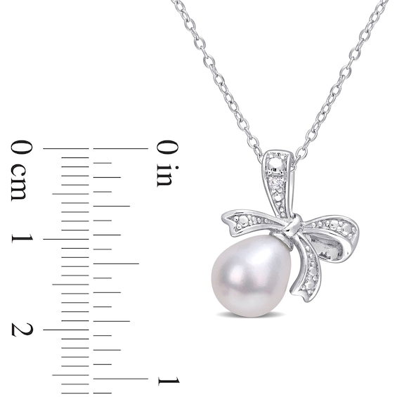 8.5-9.0mm Oval Freshwater Cultured Pearl and Diamond Accent Bow Pendant in Sterling Silver