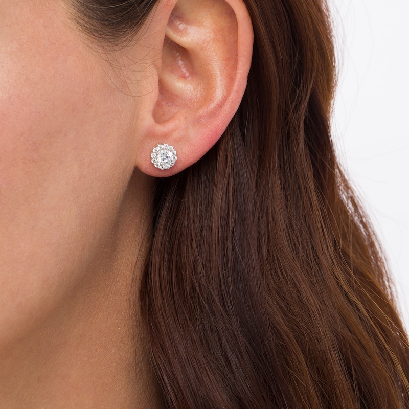 0.83 CT. T.W. Diamond Frame Flower Stud Earrings in 10K White Gold