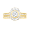 0.95 CT. T.W. Baguette and Round Diamond Sunburst Frame Bridal Set in 10K Gold