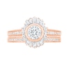 0.95 CT. T.W. Baguette and Round Diamond Sunburst Frame Bridal Set in 10K Rose Gold