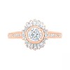 0.95 CT. T.W. Baguette and Round Diamond Sunburst Frame Bridal Set in 10K Rose Gold