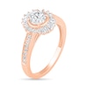 0.95 CT. T.W. Baguette and Round Diamond Sunburst Frame Bridal Set in 10K Rose Gold