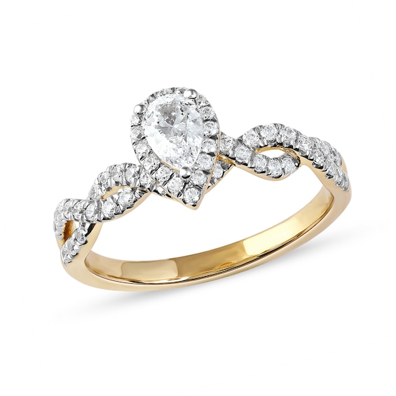 0.75 CT. T.W. Pear-Shaped Diamond Frame Twist Shank Engagement Ring in 10K Gold (I/I1)