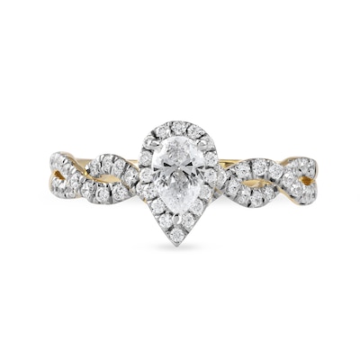 0.75 CT. T.W. Pear-Shaped Diamond Frame Twist Shank Engagement Ring in 10K Gold (I/I1)