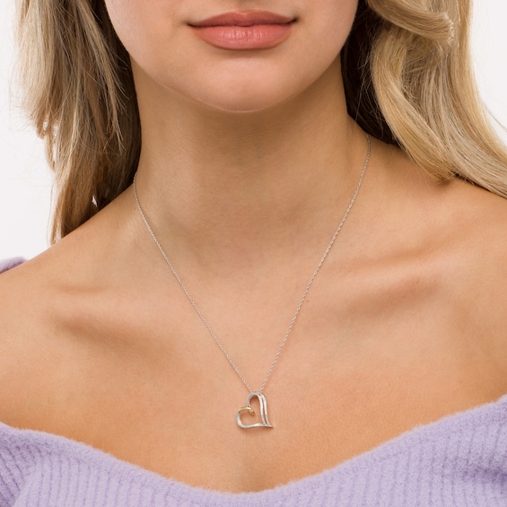 0.065 CT. T.W. Diamond Double Row Heart Pendant in Sterling Silver and 10K Rose Gold