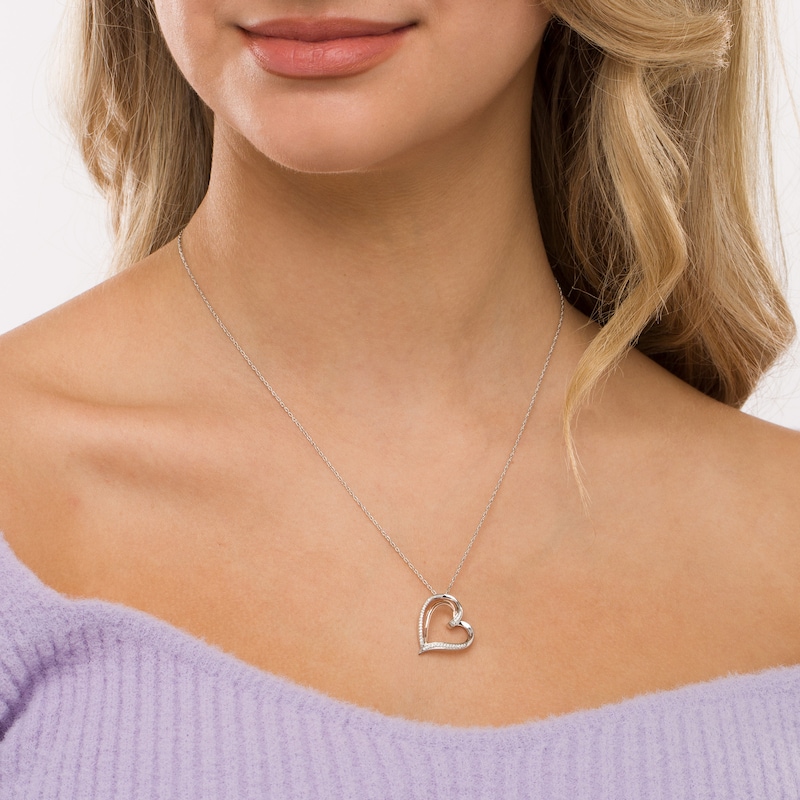 0.087 CT. T.W. Diamond Double Row Heart Pendant in Sterling Silver and 10K Rose Gold