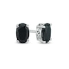 0.95 CT. T.W. Oval Black Enhanced Diamond Solitaire Stud Earrings in 10K Gold