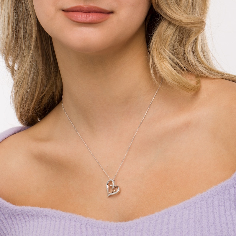 0.085 CT. T.W. Diamond Tilted Double Heart Pendant in Sterling Silver and 10K Rose Gold