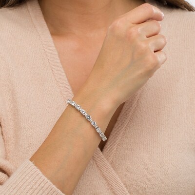 5.0mm White Lab-Created Sapphire and 0.04 CT. T.W. Diamond Oval Frame Line Bracelet in Sterling Silver - 7.5"