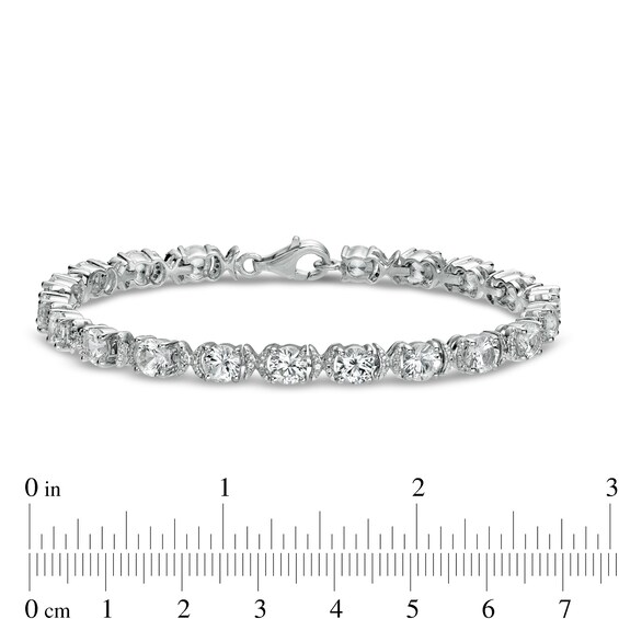 5.0mm White Lab-Created Sapphire and 0.04 CT. T.W. Diamond Oval Frame Line Bracelet in Sterling Silver - 7.5"