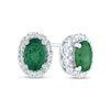 Oval Emerald and 0.10 CT. T.W. Diamond Frame Stud Earrings in 14K Gold