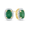 Thumbnail Image 1 of Oval Emerald and 0.10 CT. T.W. Diamond Frame Stud Earrings in 14K Gold