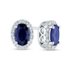 Thumbnail Image 0 of Oval Blue Sapphire and 0.10 CT. T.W. Diamond Frame Stud Earrings in 14K White Gold