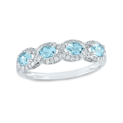 Sideways Oval Aquamarine and 0.22 CT. T.W. Diamond Frame Four Stone Ring in 14K Gold