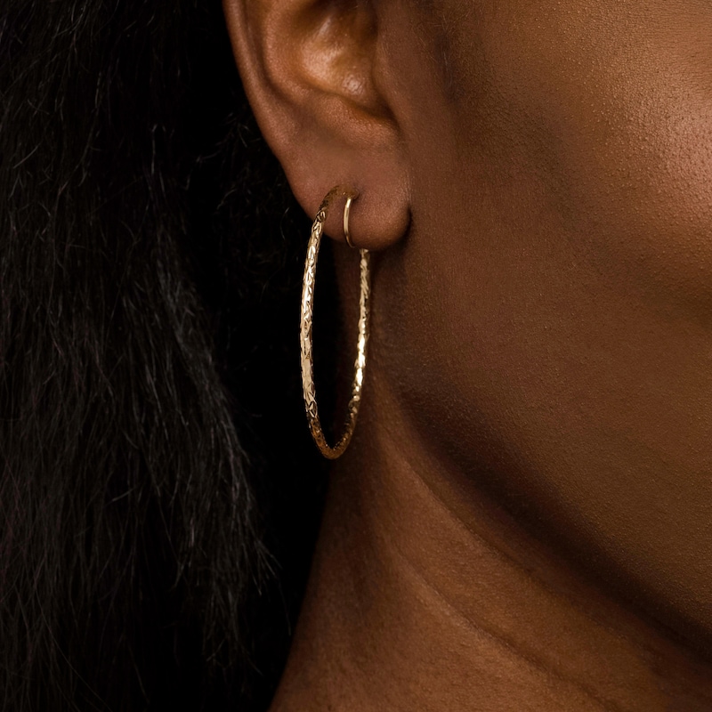 50.0mm Diamond-Cut Inside-Out Tube Oval Hoop Earrings in 14K Gold|Peoples Jewellers