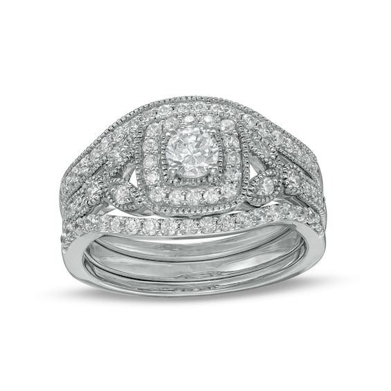 0.69 CT. T.W. Diamond Cushion-Shaped Frame Vintage-Style Three Piece Bridal Set in 10K White Gold (J/I3)