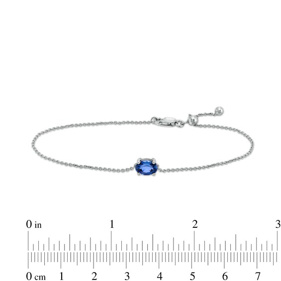 Sideways Oval Blue Lab-Created Sapphire Solitaire Adjustable Bracelet in 10K White Gold - 7.5"