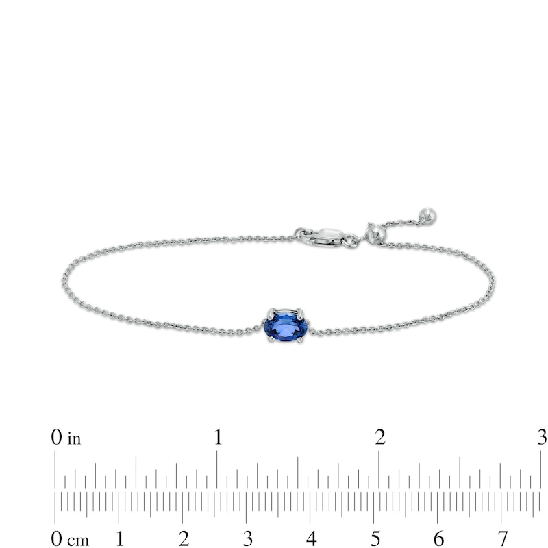 Sideways Oval Blue Lab-Created Sapphire Solitaire Adjustable Bracelet in 10K White Gold - 7.5"|Peoples Jewellers