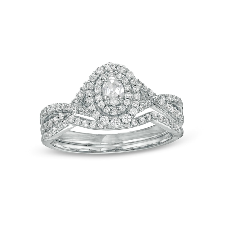 0.58 CT. T.W. Oval Diamond Double Frame Twist Shank Bridal Set in 10K White Gold (I/I2)|Peoples Jewellers
