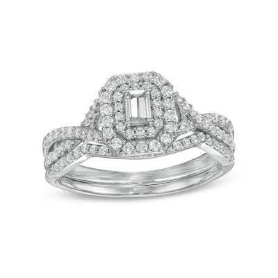 0.58 CT. T.W. Emerald-Cut Diamond Double Frame Twist Shank Bridal Set in 10K White Gold (I/I2)