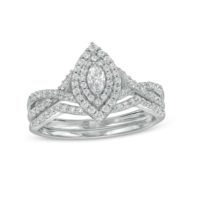 0.58 CT. T.W. Marquise Diamond Double Frame Twist Shank Bridal Set in 10K White Gold (I/I2)