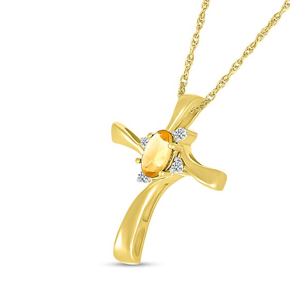 Oval Citrine and Diamond Accent Swirl Ribbon Cross Pendant in 10K Gold