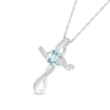 Oval Aquamarine and 0.04 CT. T.W. Diamond Infinity Ribbon Cross Pendant in 10K White Gold