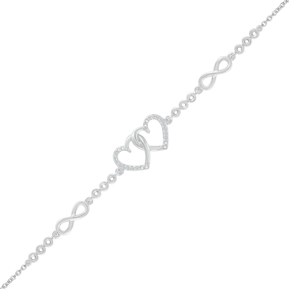 0.04 CT. T.W. Diamond Interlocking Hearts and Infinity Symbol Station Bracelet in Sterling Silver - 7.5"