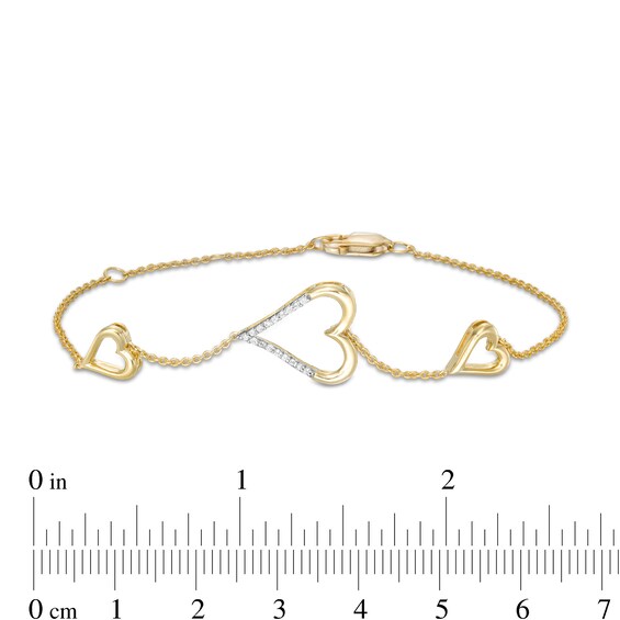 0.066 CT. T.W. Diamond Heart Trio Bracelet in 10K Gold – 7.5"